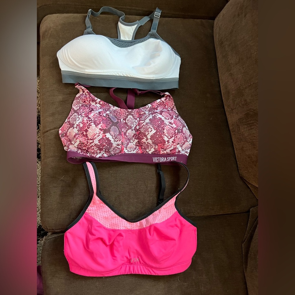 (2) Victoria’s Secret sport bras (34D&32C)  (1) Champion sports bra (Med)